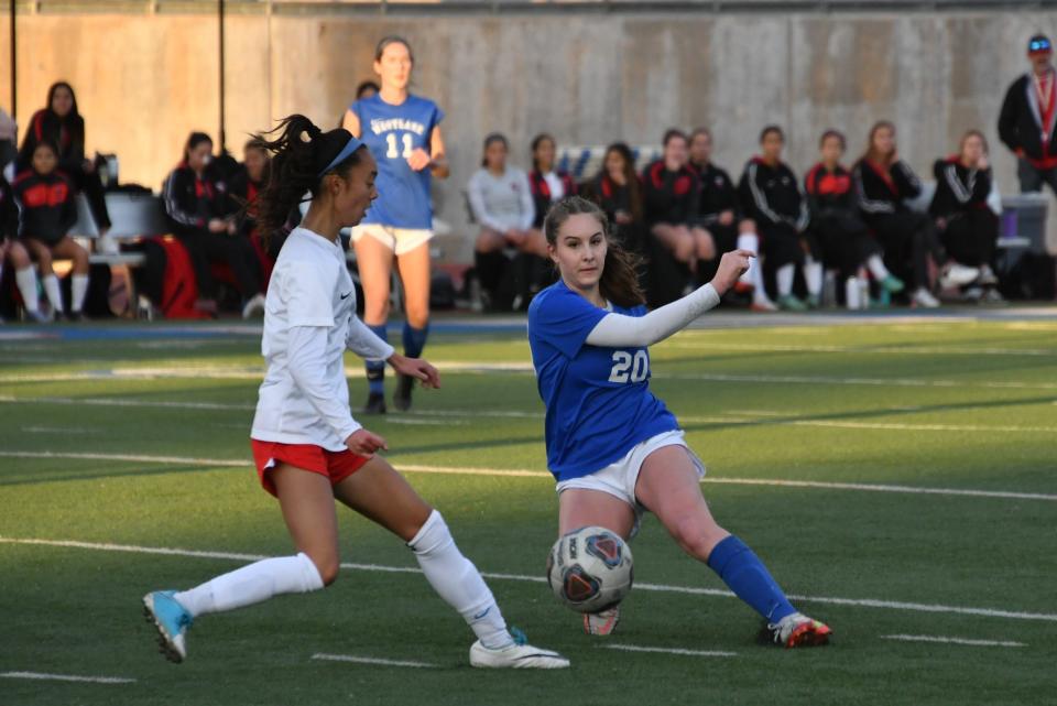 Westlake's Tatum Wynalda (right) battles a Hart player for possession during the teams' CIF-SS Division 2 quarterfinal match Saturday at Westlake High. The Warriors lost 1-0.