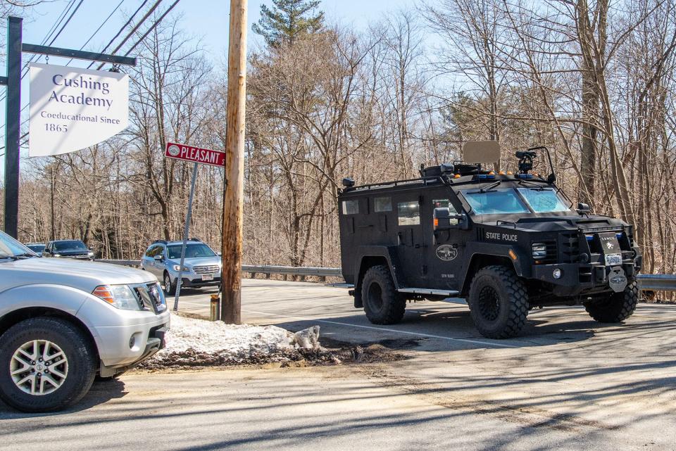 A state police tactical vehicle leaves the area of the Cushing Academy campus after a chase and standoff ended there Thursday.
