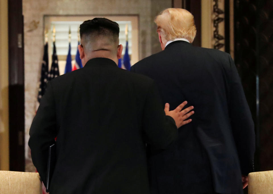 President Trump and North Korean leader Kim Jong Un leave after signing documents at their summit in Singapore on June 12, 2018. (Photo: Jonathan Ernst/Reuters)