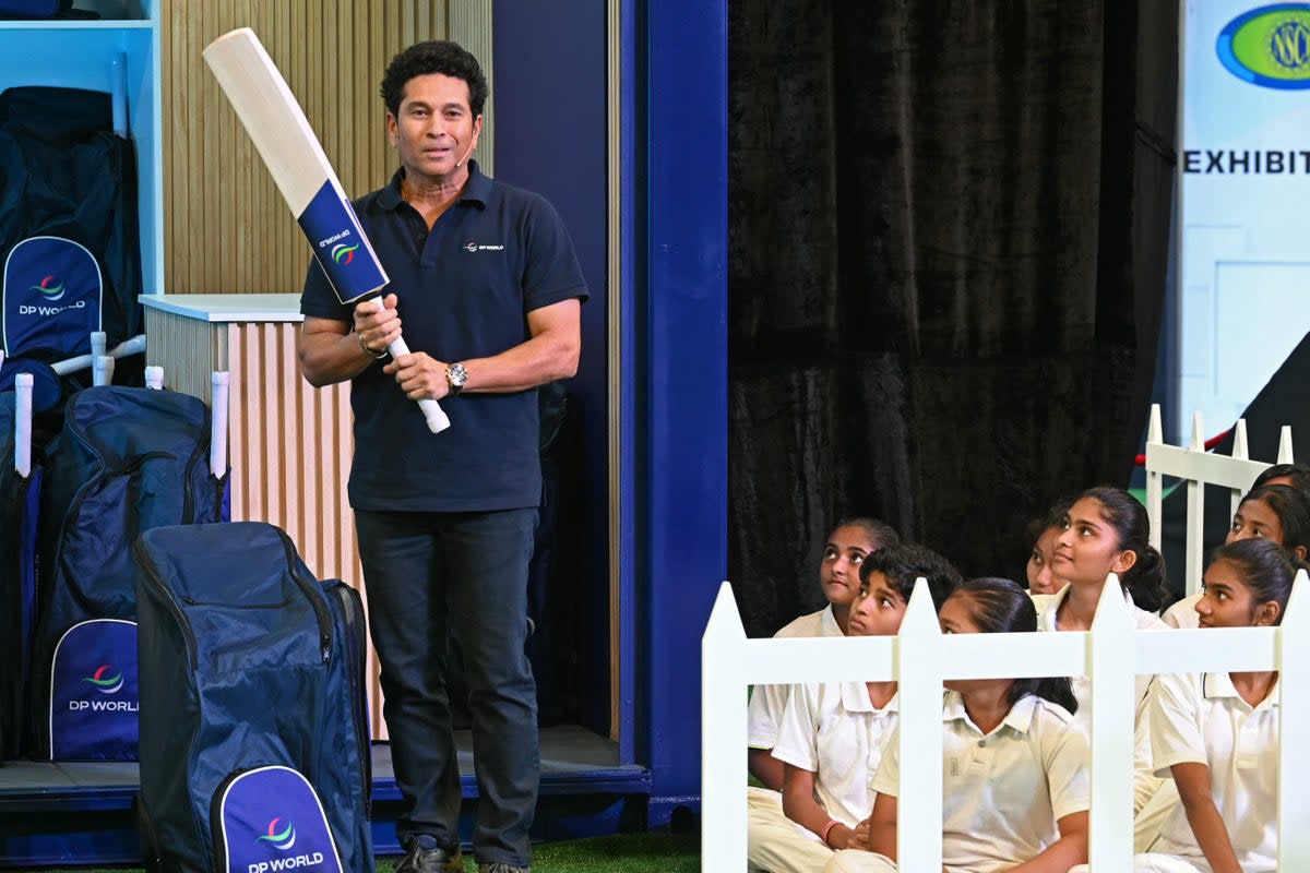 India legend Sachin Tendulkar appears at an event in Mumbai on 4 October on the eve of the Cricket World Cup, where he is a global ambassador  (AFP via Getty Images)