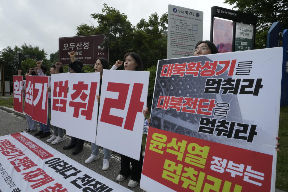 South Koreans stage a protest demanding stopping of propaganda amid rising tensions between North and South Korea near the Unification Observation Post in Paju, South Korea, near the border with North Korea, Wednesday, July 24, 2024. The signs read: "Stop loudspeakers and leaflets against North Korea." (AP Photo/Ahn Young-joon)
