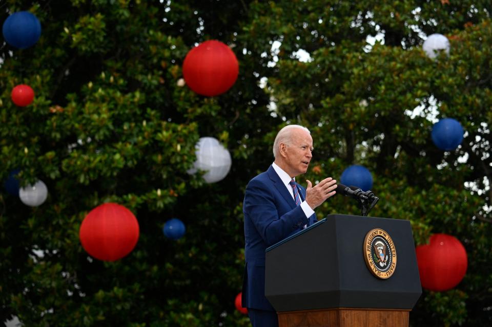 President Joe Biden thanks the military and essential workers during Independence Day celebrations on the South Lawn of the White House.