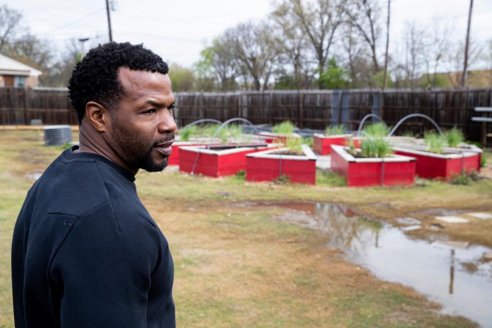 Melvin Cole, founder of PURE Academy, speaks about the garden seen behind him as he discusses the agribusiness programs that are taught at the school while giving a tour of the academy in Memphis, Tenn., on Tuesday, March 26, 2024.