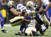 New Orleans Saints defensive end Akiem Hicks (76) and other defenders tackle Buffalo Bills running back Tashard Choice (20) during the second half at Mercedes-Benz Superdome. New Orleans defeated Buffalo 35-17. Mandatory Credit: Crystal LoGiudice-USA TODAY Sports