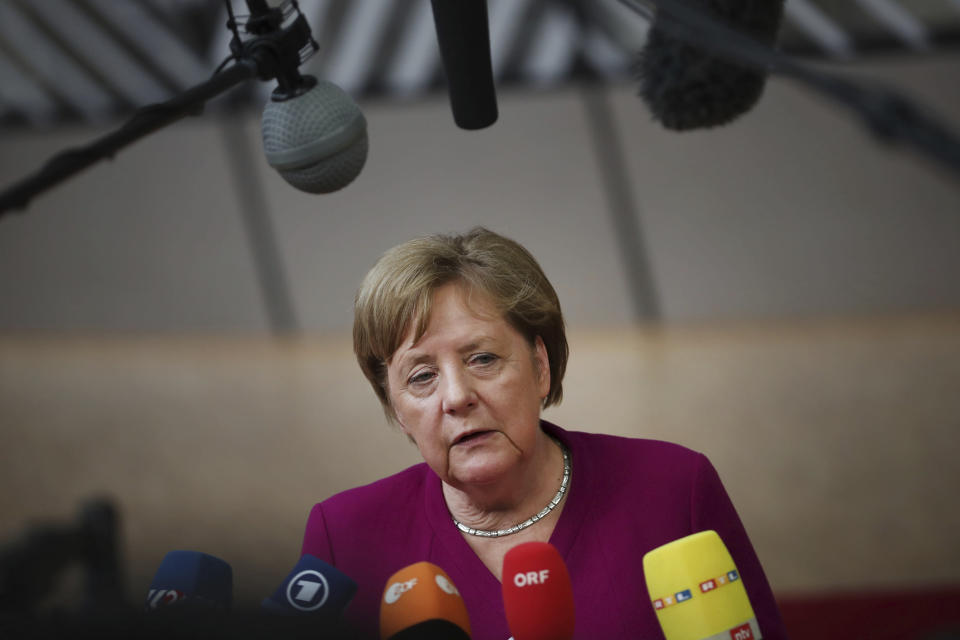 German Chancellor Angela Merkel speaks with the media as she arrives for an EU summit in Brussels, Tuesday, May 28, 2019. European Union leaders are meeting in Brussels to haggle over who should lead the 28-nation bloc's key institutions for the next five years after weekend elections shook up Europe's political landscape. (AP Photo/Francisco Seco)