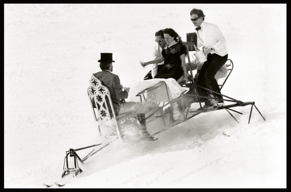 David Kirke, Tim Hunt, Nicky Slade and Lord Xan Rufus Isaacs going down the Saint Moritz slopes on a dining table (Dafydd Jones)