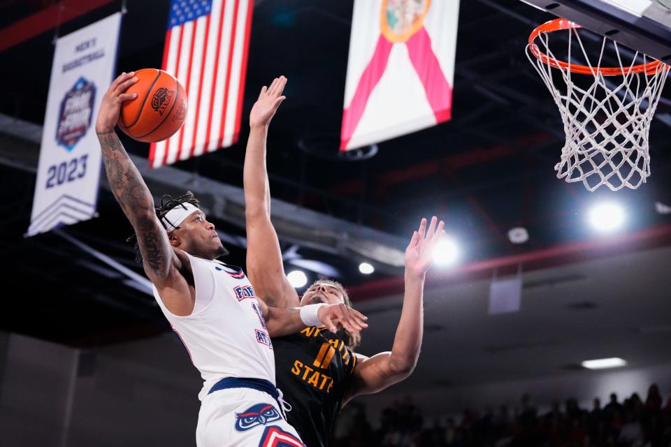 FAU guard Alijah Martin, who led the Owls with 22 points, goes up for a shot against Wichita State's Kenny Pohto during Thursday night's game in Boca Raton.