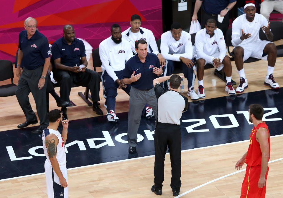 LONDON, ENGLAND - AUGUST 12: The referee calls an unsportsmanlike foul against the United States coach Michael Kryzewski during the Men's Basketball gold medal game between the United States and Spain on Day 16 of the London 2012 Olympics Games at North Greenwich Arena on August 12, 2012 in London, England. (Photo by Streeter Lecka/Getty Images)