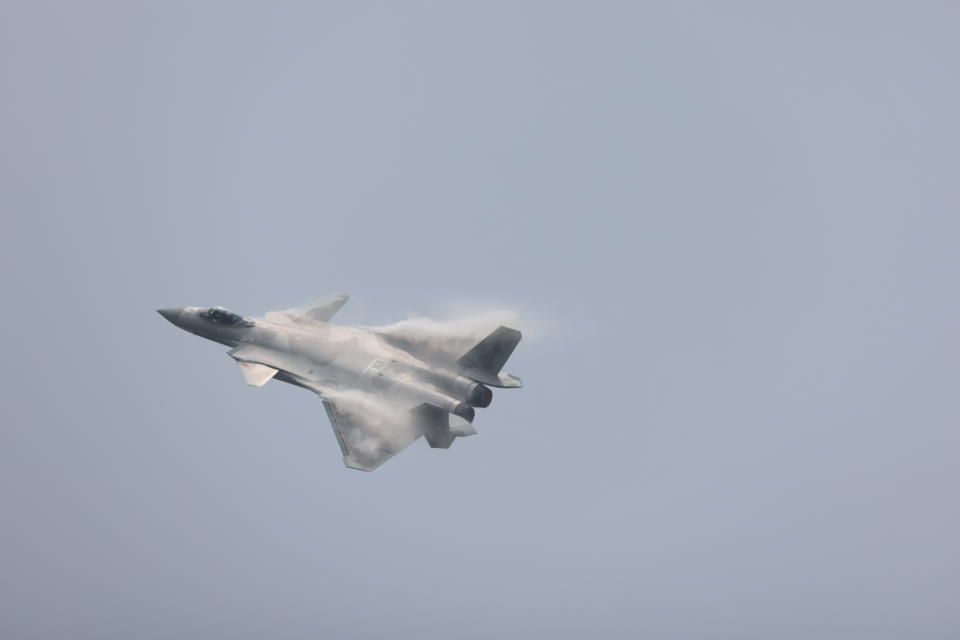 ZHUHAI, CHINA - SEPTEMBER 28: J-20 stealth fighter jet performs in the sky on day one of the China International Aviation & Aerospace Exhibition (Airshow China) 2021 on September 28, 2021 in Zhuhai, Guangdong Province of China. (Photo by Qian Baihua/VCG via Getty Images)