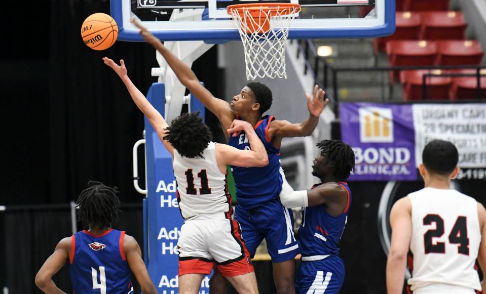 Melian Martinez of NFEI blocks the shot of Adrian Cruz of Sagemont in the 2022 state semifinal. One year after losing to Sagemont on a 40-point game from Cruz, NFEI meets Sagemont again in Wednesday's semifinal.