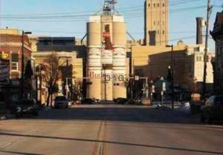 A mural of a Budweiser bottle and two Budweiser cans painted on a malt plant overlooks downtown Manitowoc, Wisconsin, January 18, 2016. The television documentary "Making a Murderer," -- from the case against Steven Avery and Brendan Dassey, who were convicted of killing freelance photographer Teresa Halbach in 2005 -- has put Manitowoc on the map. Picture taken January 18, 2016. REUTERS/Brendan O'Brien