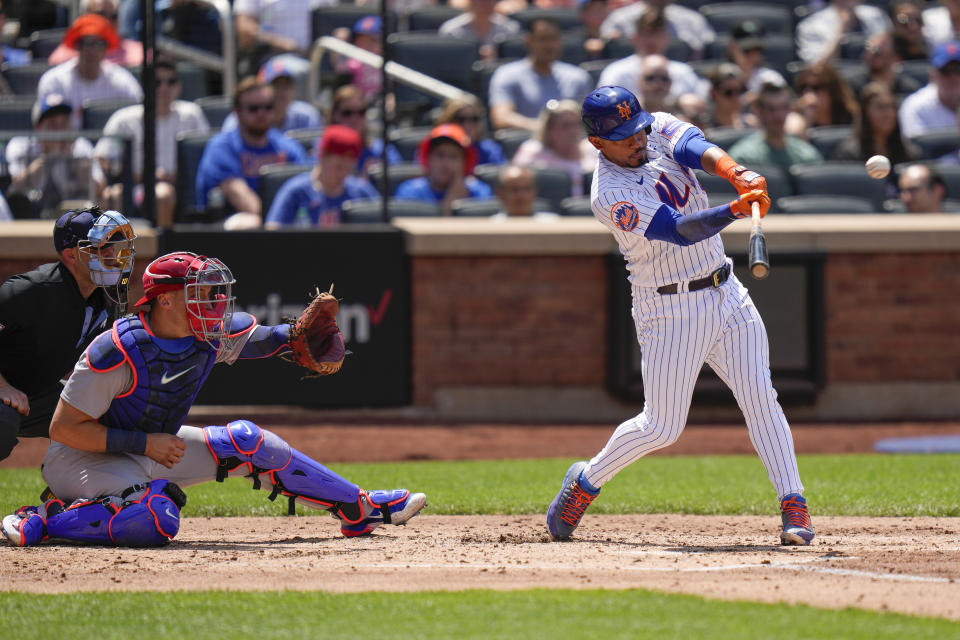 New York Mets' Eduardo Escobar hits an RBI triple during the second inning of a baseball game against the St. Louis Cardinals at Citi Field, Sunday, June 18, 2023, in New York. (AP Photo/Seth Wenig)