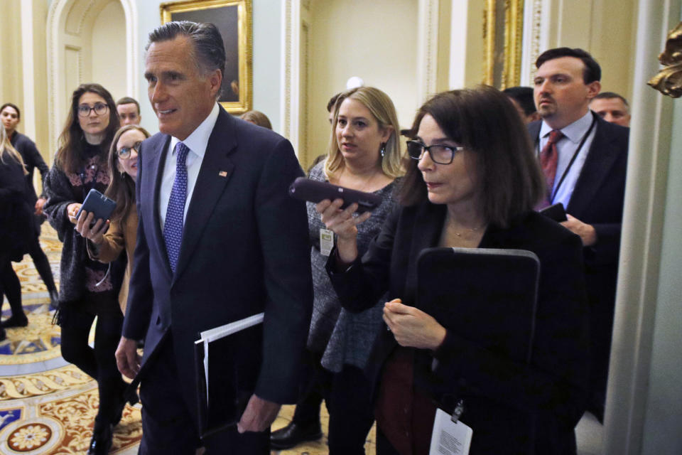 Sen. Mitt Romney, R-Utah, walks to a Republican luncheon outside the Senate chamber prior to the start of the impeachment trial of President Donald Trump at the U.S. Capitol Friday Jan 31, 2020, in Washington, as Senators continue the impeachment trial for President Donald Trump. (AP Photo/Steve Helber)