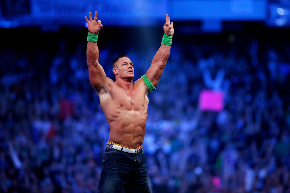 John Cena celebrates his win during Wrestlemania XXX at the Mercedes-Benz Super Dome in New Orleans on Sunday, April 6, 2014. (Jonathan Bachman/AP Images for WWE)