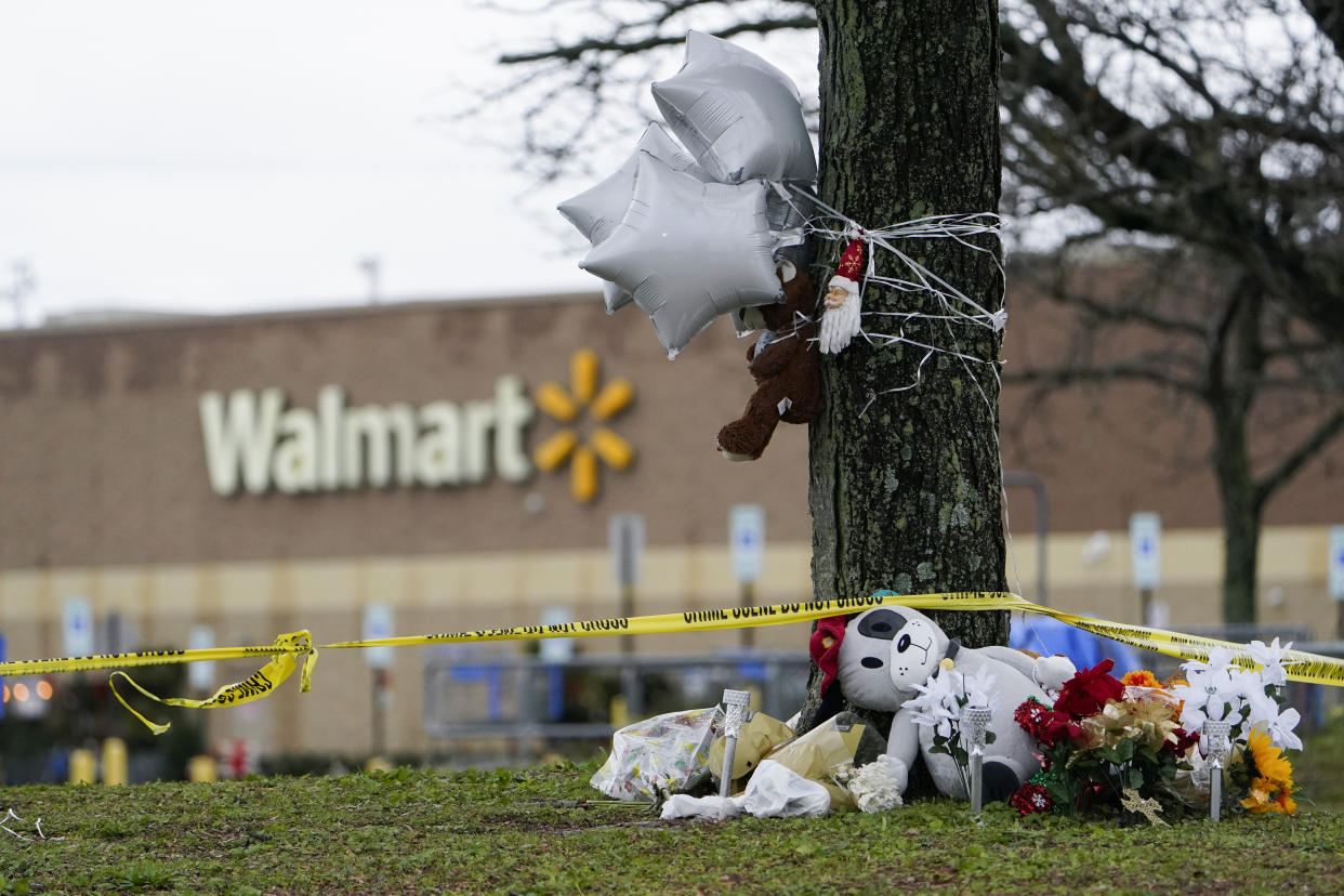 A makeshift memorial is seen in the parking lot of the Walmart Supercenter in Chesapeake, Va., Sunday, Nov. 27, 2022. Six people were killed when a manager opened fire at the store with a handgun on Tuesday. (AP Photo/Carolyn Kaster)