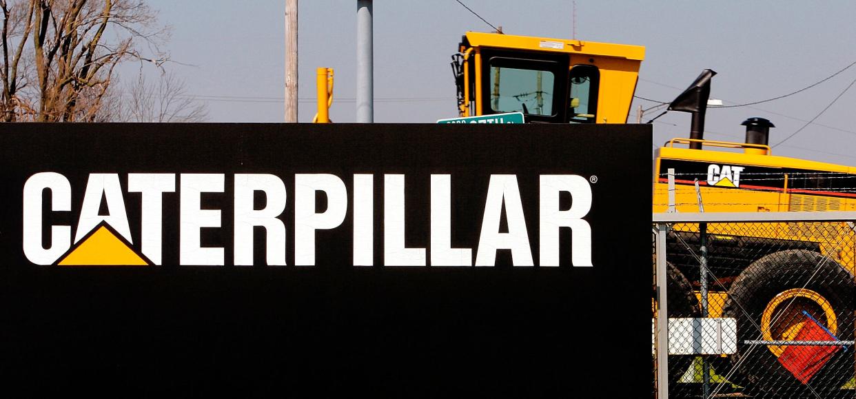 n this April 20, 2007 file photo, a Caterpillar grader is trucked out of the plant in Decatur, Ill. Caterpillar Inc. said Friday, April 5, 2013, it plans to lay off more than 460 employees this June at its Decatur plant as part of an ongoing series of production cuts. (AP Photo/Seth Perlman,. File)