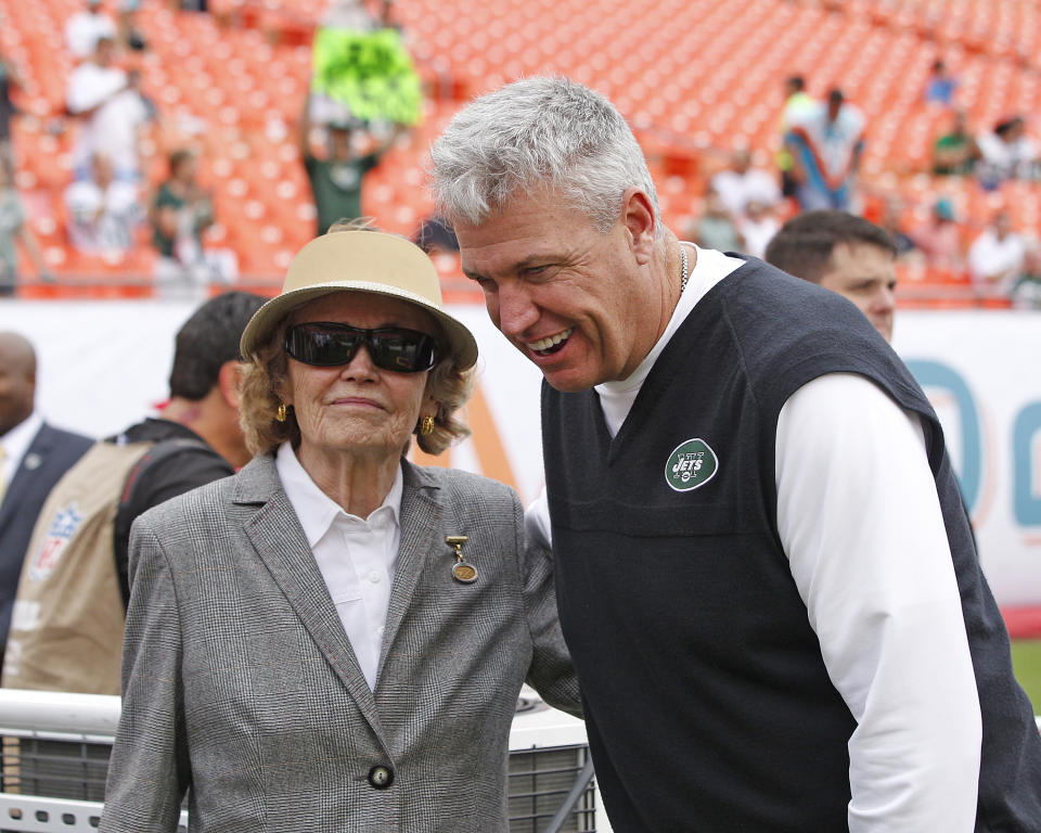 Former New York Jets head coach Rex Ryan stands with Betty Wold Johnson, the mother of the Jets' owners, before a game against the Dolphins in Miami in 2013.