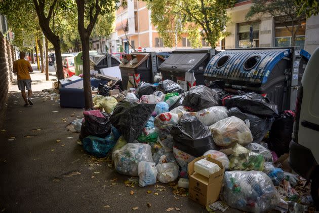ROME, ITALY - JULY 07: A resident walks past overflowing trash bins on the streets, as the city struggles with a garbage problem aggravated by the summer heat, on July 7, 2021 in Rome, Italy. (Photo by Antonio Masiello/Getty Images) (Photo: Antonio Masiello via Getty Images)