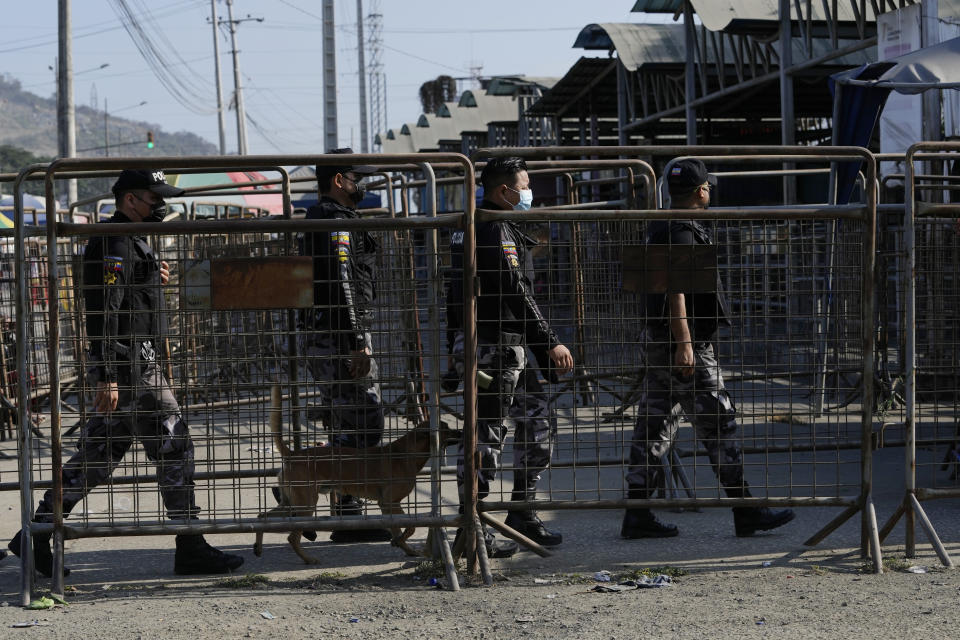 Security forces enter Litoral Penitentiary after deadly fights inside in Guayaquil, Ecuador, Thursday, July 22, 2021. Rival gangs of inmates fought in two prisons in Ecuador, killing at least 18 people and injuring dozens, authorities said Thursday. (AP Photo/Dolores Ochoa)