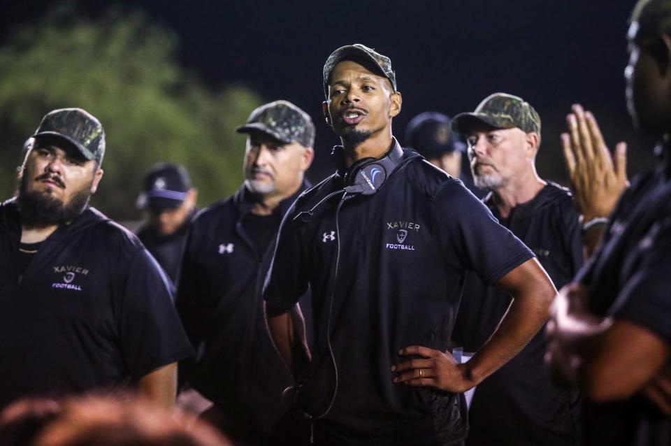 Xavier Prep Head Coach James Dockery talks to his team after their loss to Aquinas at home in Palm Desert, Calif., Friday, Sept. 1, 2023.