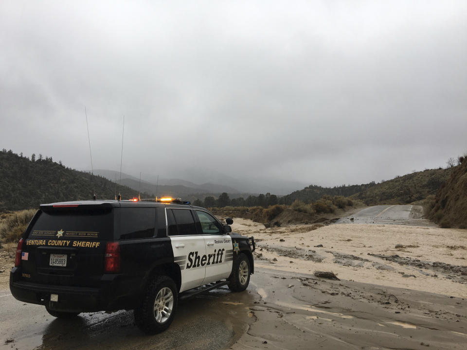 This Thursday, Jan. 17, 2019 photo provided by the Ventura County Sheriff's Dept. shows a flooded out crossing of Reyes Creek in Lockwood Valley in Ventura County, Calif. Californians were cleaning up and drying off Friday after a series of storms dumped heavy rain and snow throughout the state, caused at least six deaths and forced the rescue of more than a dozen people in rushing rivers.(Ventura County Sheriff's Dept. via AP)