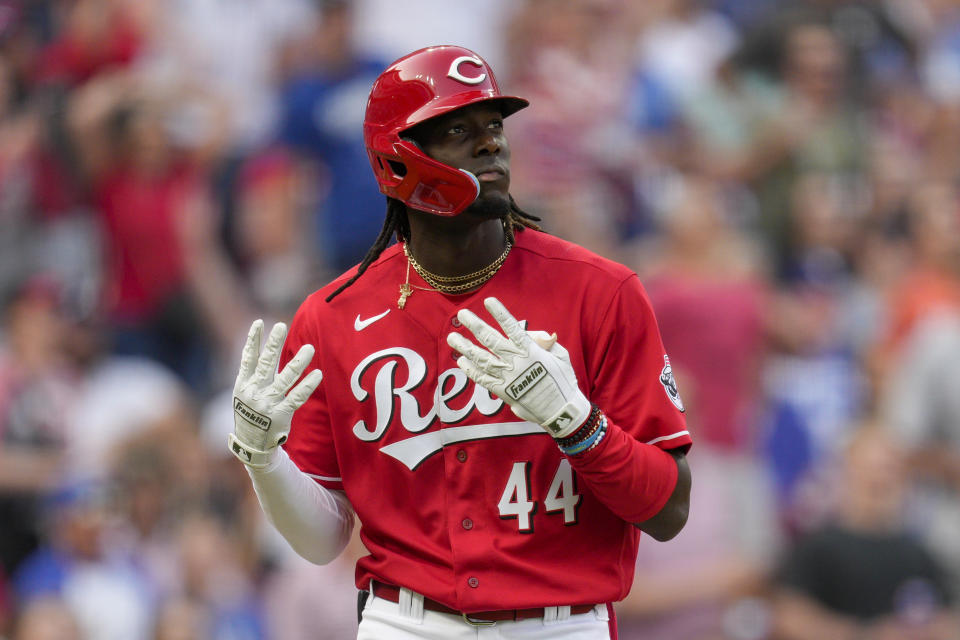 Cincinnati Reds' Elly De La Cruz gestures as he watches his two-run home run against the Los Angeles Dodgers, his first homer in the majors, during the first inning of a baseball game in Cincinnati, Wednesday, June 7, 2023. (AP Photo/Jeff Dean)