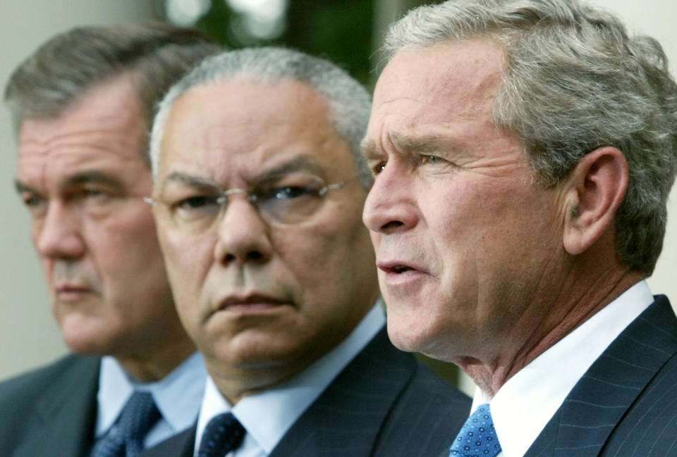 WASHINGTON - AUGUST 2:  U.S. President George W. Bush (R) speaks as Secretary of Homeland Security Tom Ridge (L) and Secretary of State Colin Powell (C) listen during a news conference in the Rose Garden of the White House August 2, 2004 in Washington, DC. Bush called for creating a national intelligence director as part of an overhaul to prevent terrorist attacks like those of September 11, 2001.  (Photo by Alex Wong/Getty Images)