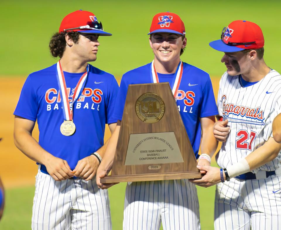 Westlake players hold their state semifinalist trophy after the 11-1 loss to Pearland in the Class 6A semifinals Friday night at Dell Diamond. The Chaparrals made their first trip to the state baseball tournament in 14 years.