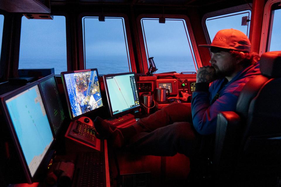 Capt. Garrett Kavanaugh pilots the Fishing Vessel Insatiable late into the night. He has made large investments in equipment, fuel, and labor, betting on Dungeness crabs as the future of his Alaskan fishing business.