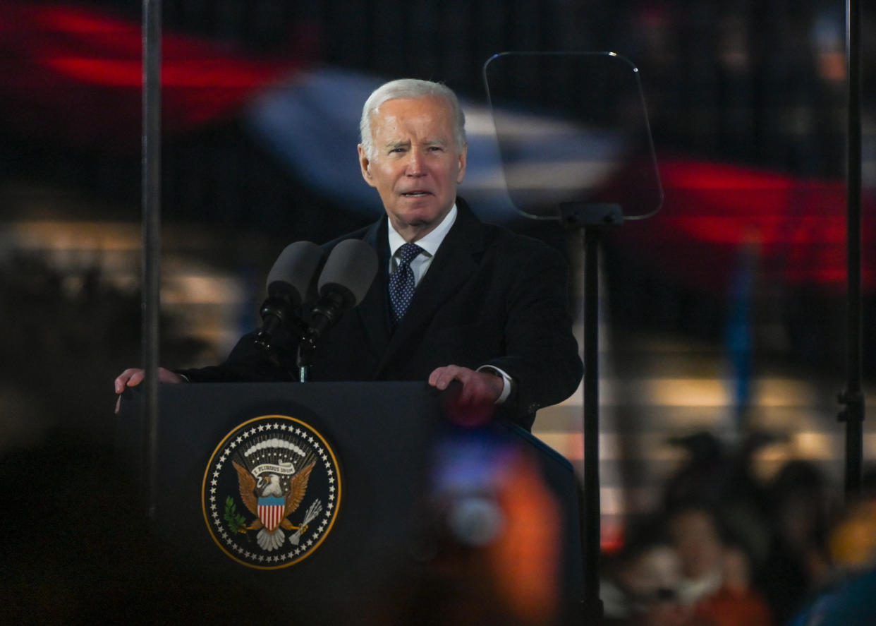 President Biden at a podium marked with the presidential seal.