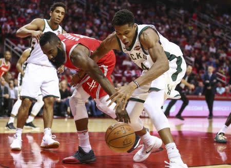 Dec 16, 2017; Houston, TX, USA; Houston Rockets guard James Harden (13) and Milwaukee Bucks forward Giannis Antetokounmpo (34) battle for a loose ball during the second quarter at Toyota Center. Mandatory Credit: Troy Taormina-USA TODAY Sports