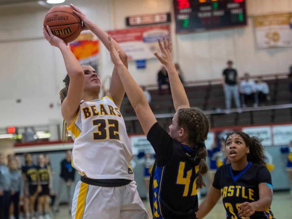 Central's Madalynn Shirley (32) shoots over Castle’s Aleyna Quinn (42) as the Central Bears play the Castle Knights during the first round of the 2023 IHSAA Class 4A Girls Basketball Sectional at Harrison High School in Evansville, Ind., Thursday, Feb. 2, 2023. 