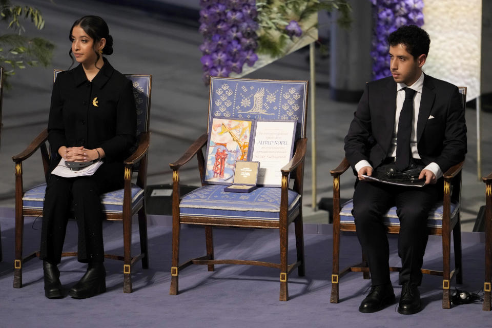 Kiana Rahmani, left, and Ali Rahmani attend the awarding of the Nobel Peace Prize for 2023 in Oslo City Hall, Oslo, Norway, Sunday, Dec. 10, 2023. The children of imprisoned Iranian activist Narges Mohammadi, Ali Rahmani and Kiana Rahmani are to accept this year’s Nobel Peace Prize on her behalf. Mohammadi is renowned for campaigning for women’s rights and democracy in her country. (Fredrik Varfjell/NTB via AP)