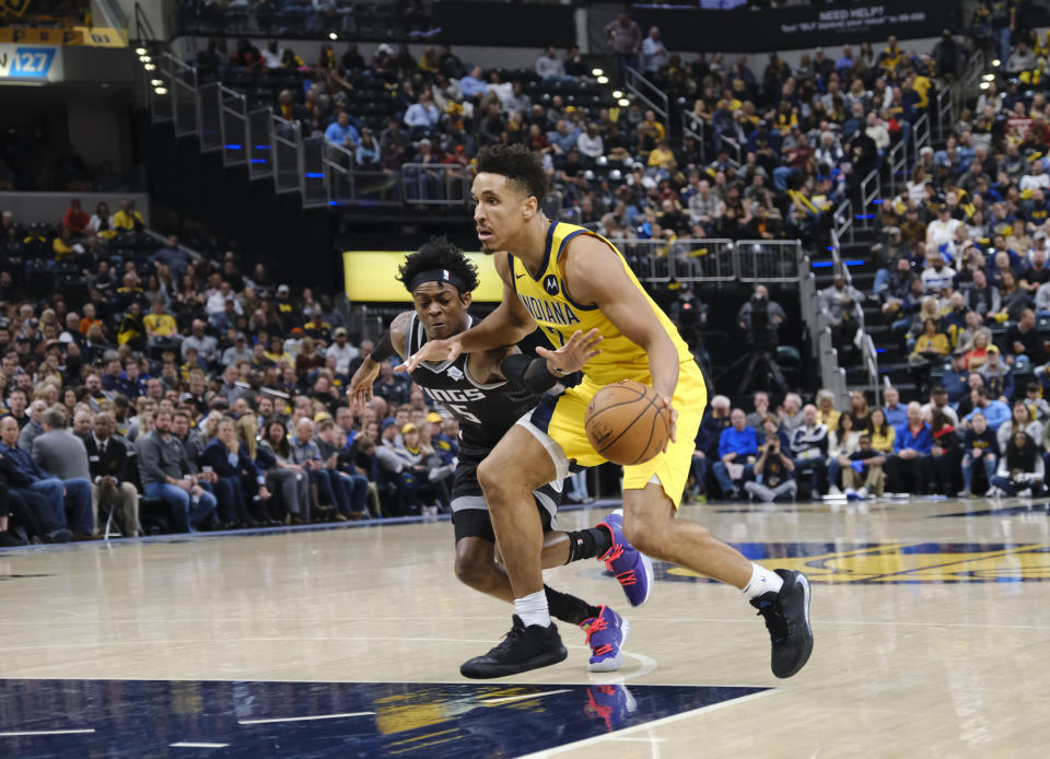 Indiana Pacers guard Malcolm Brogdon (7) is defended by Sacramento Kings forward Marvin Bagley III (35) during the second half of an NBA basketball game in Indianapolis, Friday, Dec. 20, 2019. The Pacers won 119-105. (AP Photo/AJ Mast)