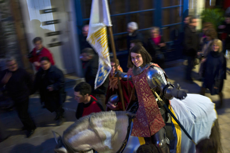 Pauline Finet performs as Joan of Arc during the opening ceremony of the 600th anniversary of the birth of Joan of Arc, in Orleans, central France, Sunday April 29, 2012. The city of Orleans goes all out with celebrations marking the 600th birthday of Joan of Arc, a national icon and symbol of French resistance through the ages at a time when French identity and France's role in the world are a focus in the presidential campaign. (AP Photo/Thibault Camus)