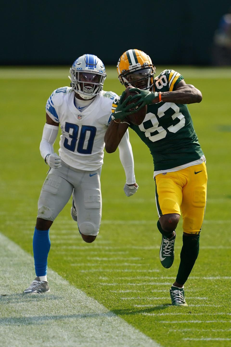 Green Bay Packers' Marquez Valdes-Scantling catches a pass in front of Detroit Lions' Jeff Okudah during the second half at Lambeau Field on Sept. 20, 2020 in Green Bay, Wis.