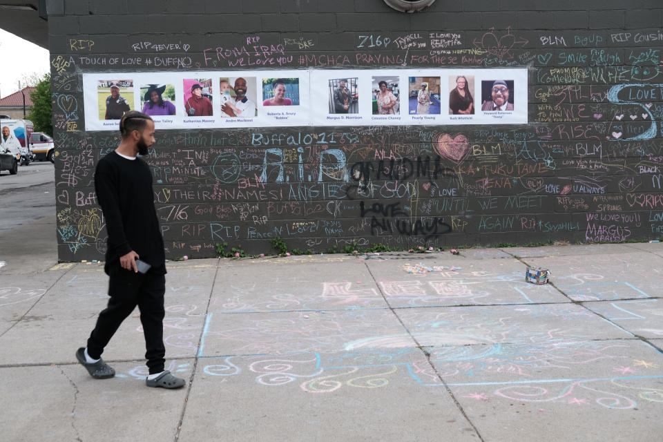 A person observes a memorial for the shooting victims outside of Tops market on May 20, 2022 in Buffalo, New York.  / Credit: / Getty Images