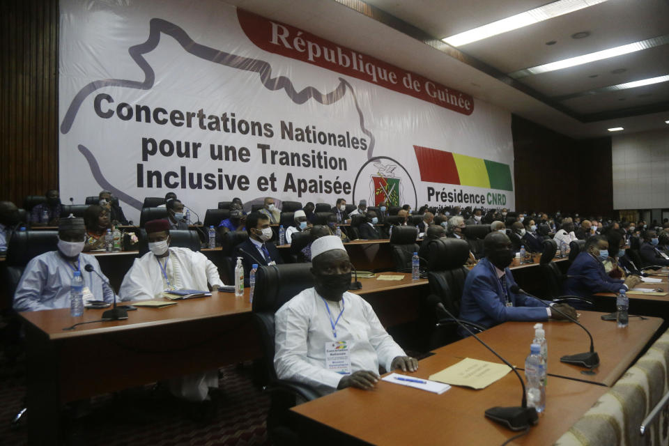 Ambassadors and foreign representations, wait for meeting with Military junta led by Col. Mamady Doumbouya, at the peoples palace in Conakry, Guinea Wednesday, Sept. 15, 2021. Guinea's junta is expected to face more pressure to set a timeframe for new elections Tuesday as the military rulers open a four-day series of meetings about the West African nation's future following the president's overthrow in a coup just over a week ago. (AP Photo/Sunday Alamba)