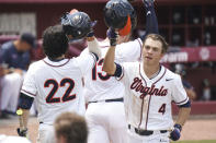 Virginia's Nic Kent (4) celebrates his fourth inning home run with Jake Gelof (22) during an NCAA college baseball tournament super regional game against Dallas Baptist on Monday, June 14, 2021, in Columbia, S.C. (AP Photo/Sean Rayford)