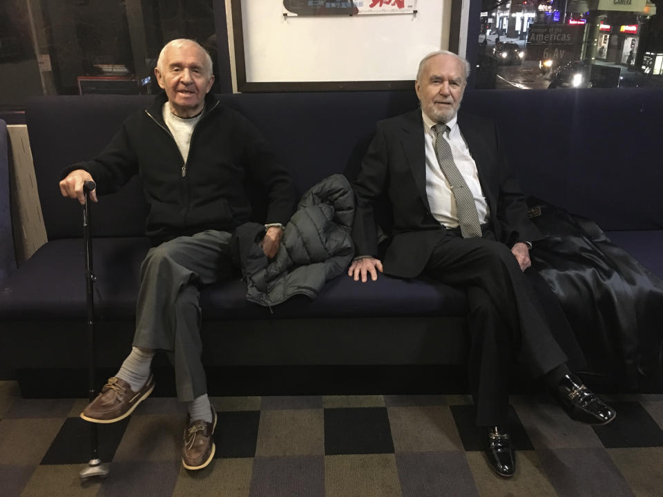 Brothers Alexander Feingold, left, and Joseph Feingold sit together on the occasion of a screening of a documentary, "Joe's Violin" featuring a donation Joseph made of a violin, at the IFC Center in New York, on Dec. 12, 2016. Joseph Feingold died at age 97 of complications from the new coronavirus, four weeks after his brother Alexander, 95, died of pneumonia at the same New York hospital. The brothers were Polish-born Holocaust survivors who had a difficult relationship shaped by the trauma of the war and the loss of their beloved mother and younger brother in Treblinka. The pandemic that gripped New York prevented a final farewell. (Raphaela Neihausen via AP)