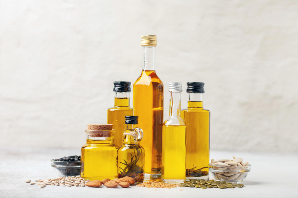 Various vegetable and nut oil in bottles on a bright background.Influencers and wellness gurus often claim seed oils are bad for you because they contain linoleic acid, an omega-6 fatty acid. But what's the truth? (Getty)