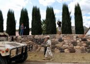 A soldier patrols the Mormon community in La Mora