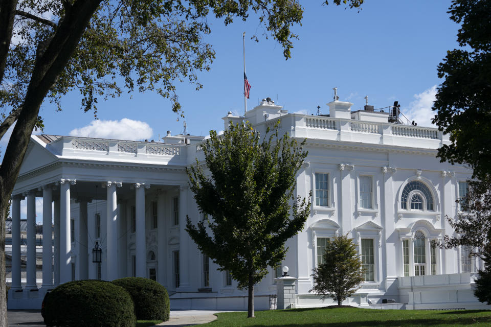 The American flag flies at half-staff above the White House to honor the late Secretary of State Colin Powell, Monday, Oct. 18, 2021, in Washington. (AP Photo/Evan Vucci)