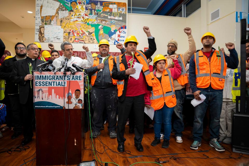 Workers raise their fists in solidarity at a press conference on March 29, 2024 hosted by the CASA day worker center to give Latino construction workers an opportunity voice their concerns after the Francis Scott Key Bridge in Baltimore, collapsed after it was struck by a large cargo ship. Eight Latino road construction workers were working on the bridge at the time, only 2 of whom were rescued.