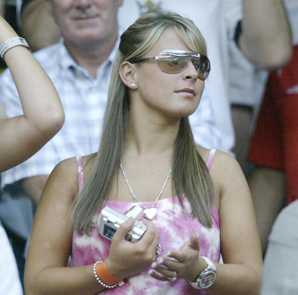 Coleen cheers on Wayne at the 2004 Euros (PA)