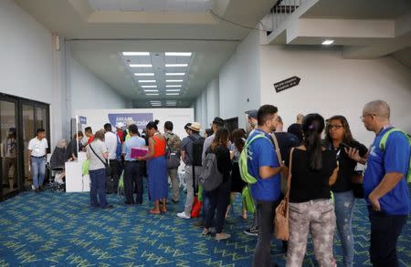 Journalists wait in line for their accreditations at Media Center, ahead of Pope Francis' visit for World Youth Day in Panama City, Panama January 22, 2019. REUTERS/Henry Romero