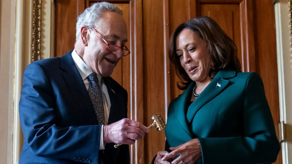 Democratic Senate Majority Leader Sen. Chuck Schumer (left) presents Vice President Kamala Harris (right) with a golden gavel Tuesday on Capitol Hill in Washington D.C. after she cast the 32nd tie-breaking vote in the Senate, the most ever cast by a vice president. (Photo: Stephanie Scarbrough/AP)