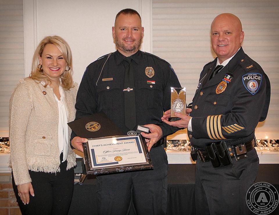 2021 Chief's Achievment Award L to R; State Rep. Melanie Miller, Officer Jeremy Jarvis, Chief David Lay