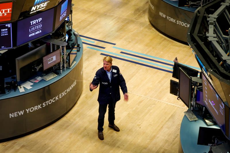 FILE PHOTO: A trader works on the floor of the NYSE in New York