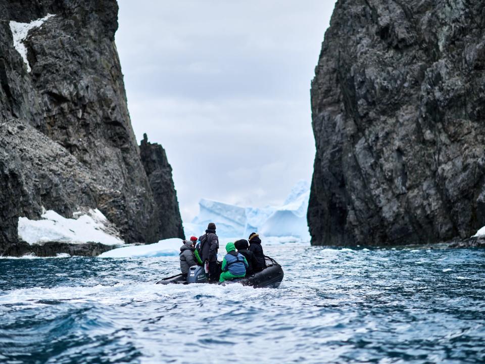 People on a small boat in icy water